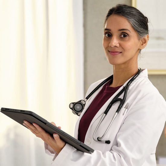 Female physician wears stethoscope