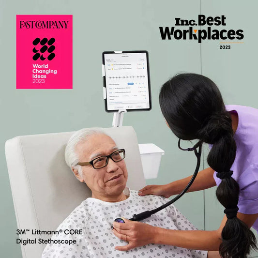 Clinician listens to patient's heart while viewing data on iPad