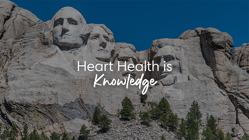 Mount Rushmore in background with "Heart Health is Knowledge" text overlay