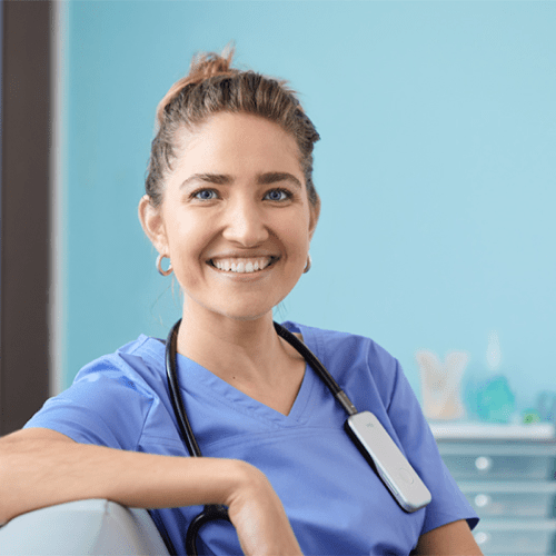 Smiling clinician with DUO 2 on shoulders