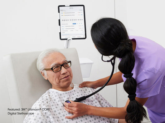 Clinician listens to patient's heart while viewing data on iPad